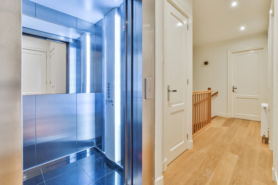 Modern domestic lift installed inside a private home hallway
