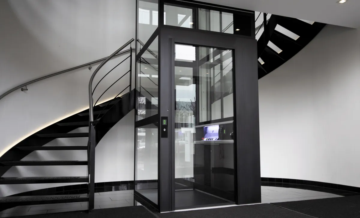Platform lift installed alongside staircase for accessibility