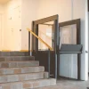 Compact step lift providing wheelchair access over short staircases
